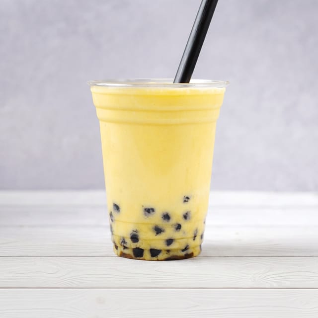 Mango Milk Tea Boba Drink.